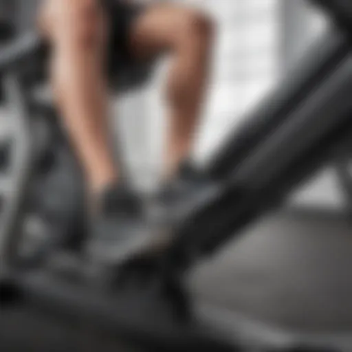 Close-up of a leg press machine showcasing its adjustable seat and arm settings.