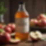 A bottle of apple cider vinegar with fresh apples