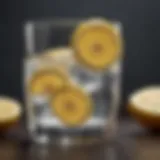 Refreshing lemon water in a transparent glass with lemon slices