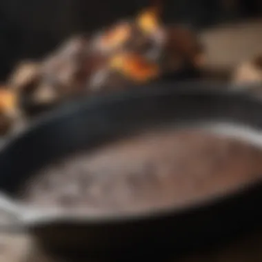 A close-up of residue on cast iron after cooking, ready for cleaning.