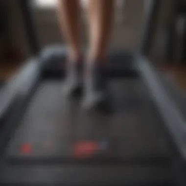 Close-up of a treadmill displaying workout metrics