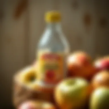 A bottle of apple cider vinegar with fresh apples
