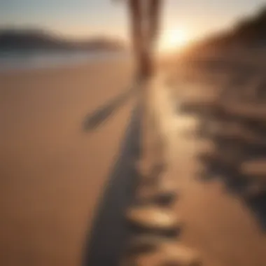Sunset Strolls and Reflection Footprints on a sandy beach during sunset